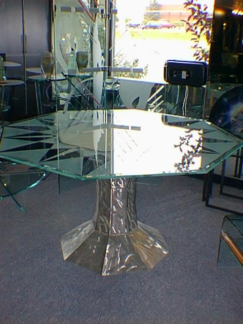 Custom stainless steel table base with etched glass top for private residence